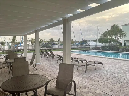 a view of a patio with swimming pool
