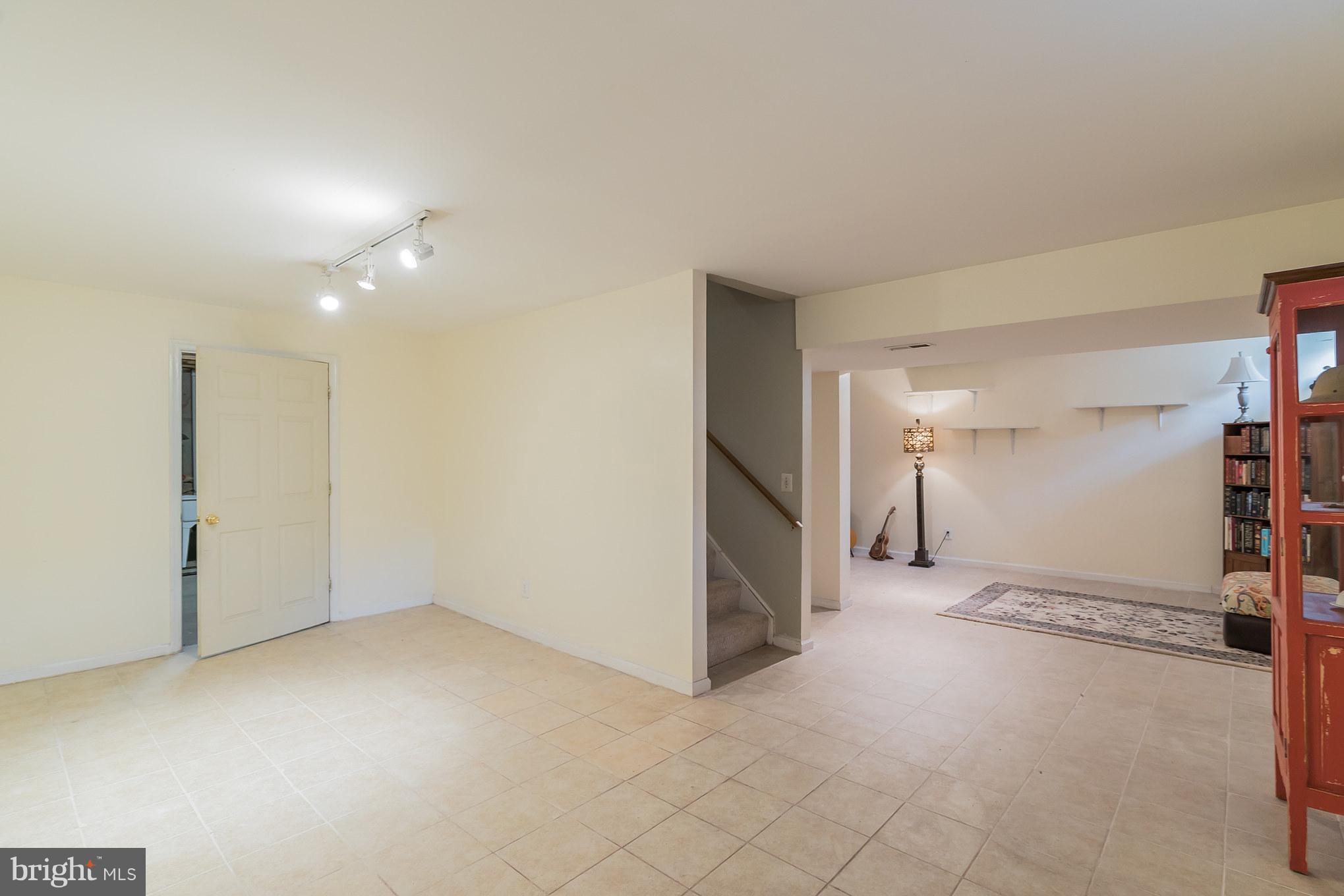 8593 Signal Hill Road Manassas, VA 20110 - Photo 23 of 30 Tile flooring throughout basement