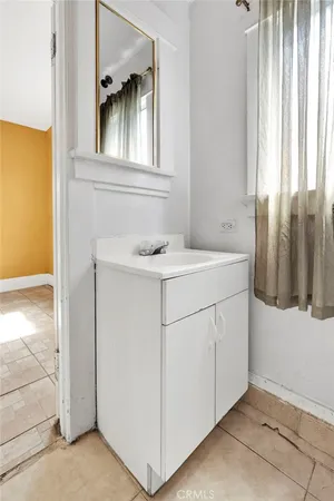 a utility room with cabinets washer and dryer