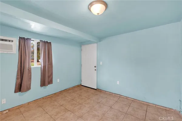 a bathroom with a sink a toilet and a window