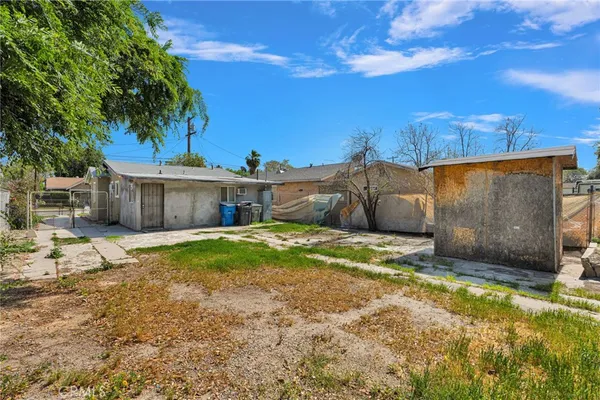 a view of a backyard of the house