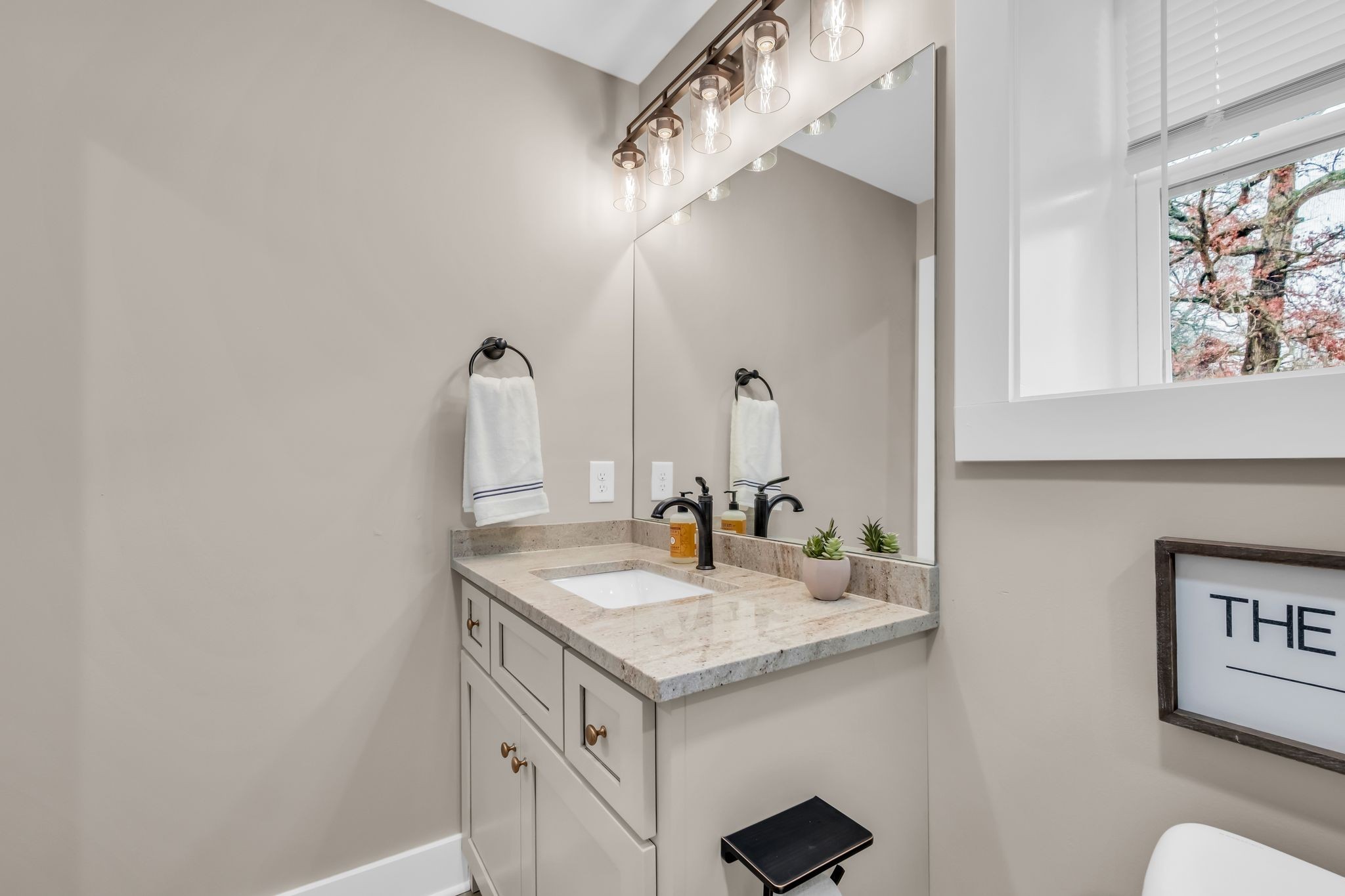 372 Lee Road Cottontown, TN 37048 - Photo 30 of 52 a bathroom with a sink and a mirror