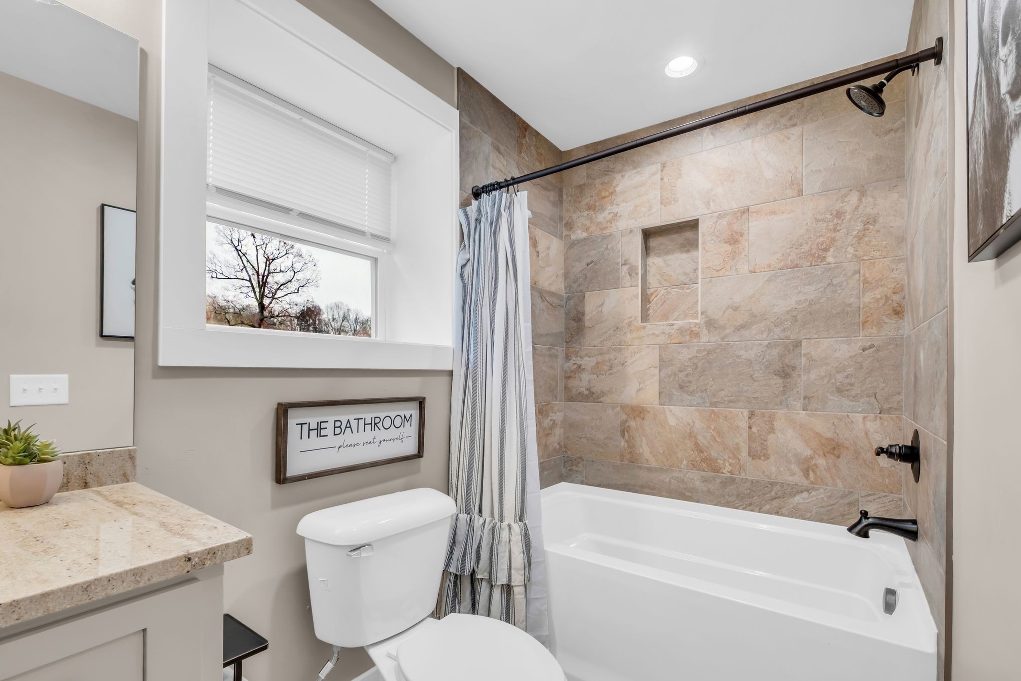 372 Lee Road Cottontown, TN 37048 - Photo 31 of 52 a bathroom with a shower a toilet a sink and a bathtub