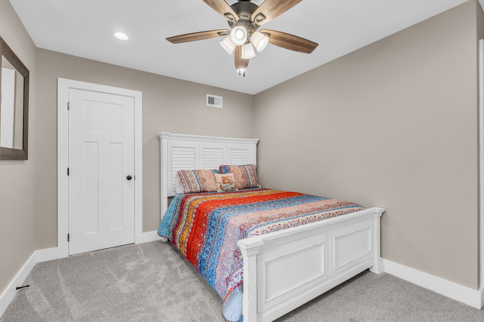 372 Lee Road Cottontown, TN 37048 - Photo 37 of 52 a bedroom with a bed and a chandelier