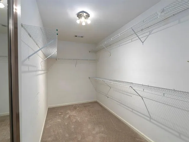 a view of a room with racks on the wall