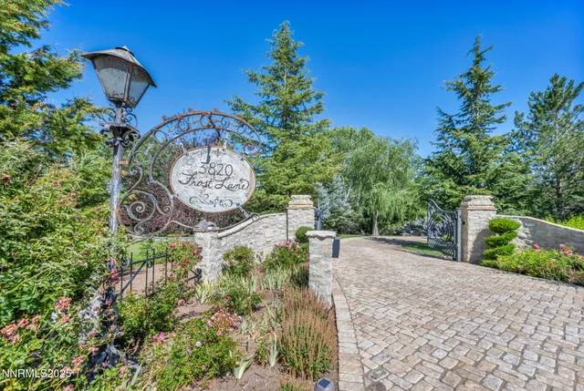 a living room with furniture fireplace and a large window