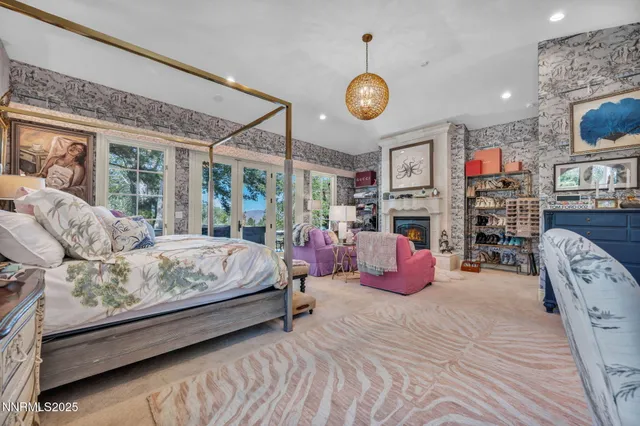 a bedroom with furniture and a fireplace