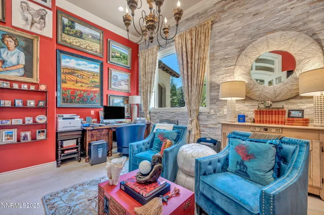 a living room with furniture and painting on the wall