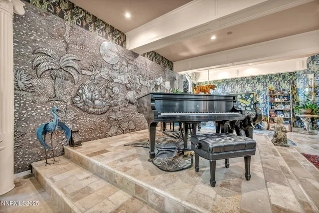 a spacious bedroom with a bed and a window