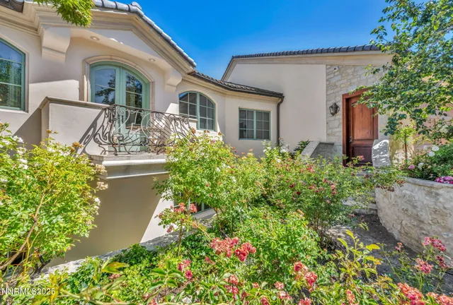 a living room with furniture a table and a large window