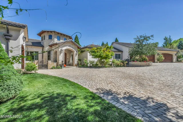 a view of a hallway with wooden floor and furniture