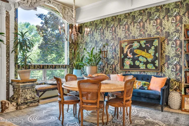 a outdoor space with lots of tables a garden view and living room view