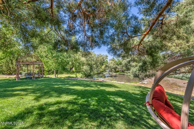 a living room with fireplace furniture and a flat screen tv