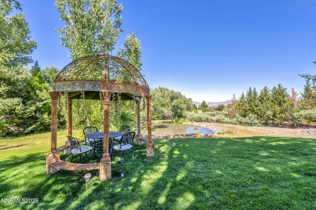 a view of living room filled with furniture and a potted plant