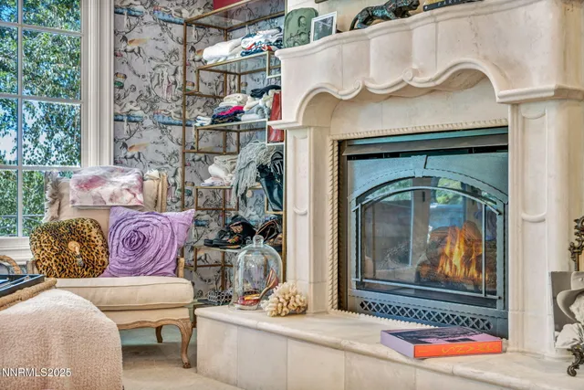 a living room with furniture and large windows