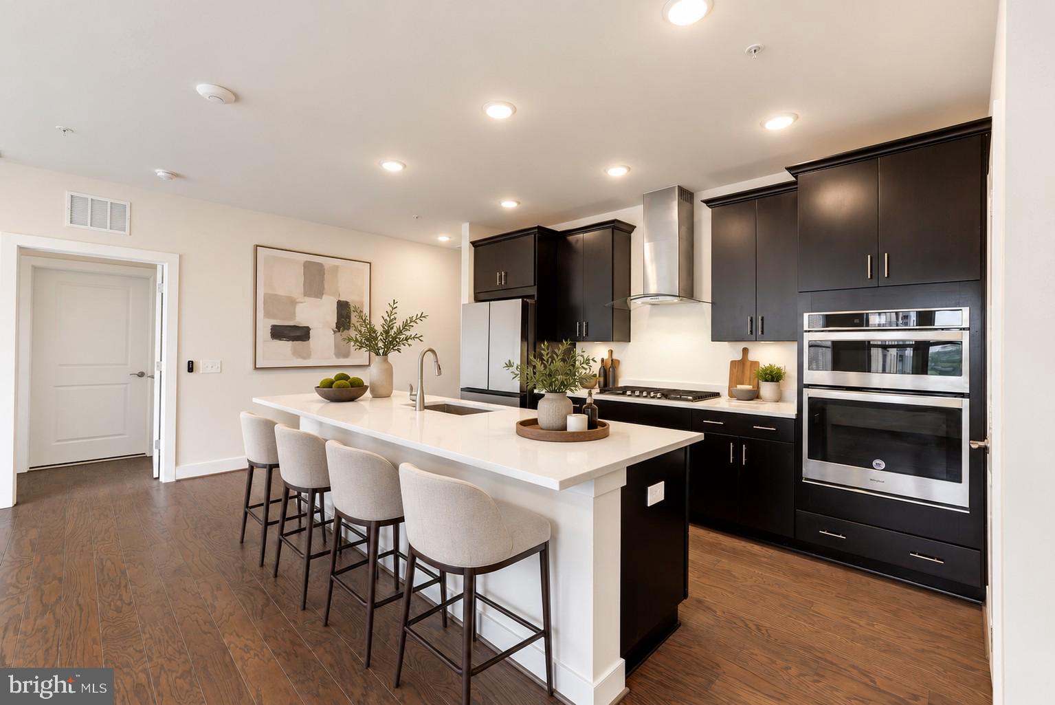 11200 Reston Station Boulevard, Unit 502 Reston, VA 20190 - Photo 5 of 40 Spacious island w/ seating, Quartz countertops