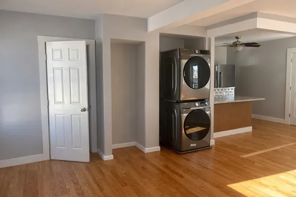 a view of a storage and utility room with washer and dryer