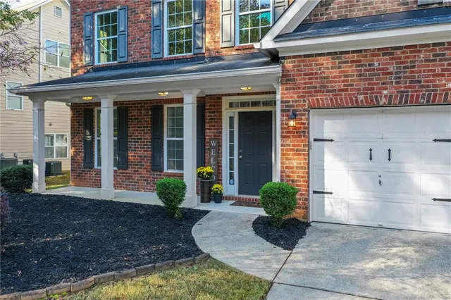 a kitchen with stainless steel appliances granite countertop a stove and a refrigerator