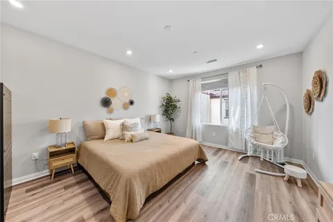 a bedroom with a bed and a table