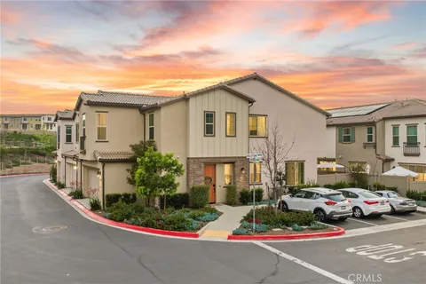 a view of multiple houses with a street