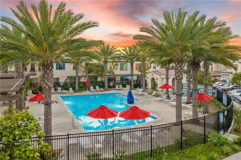 a view of swimming pool with sitting area and garden