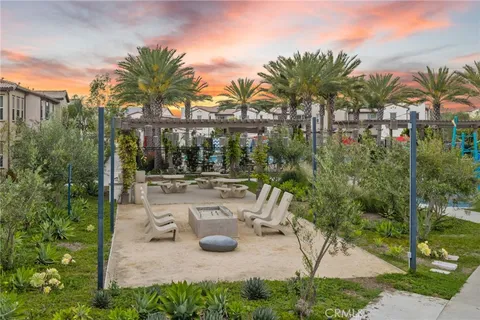 a view of a swimming pool with a patio and garden