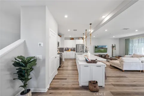 a lobby with furniture and a potted plant