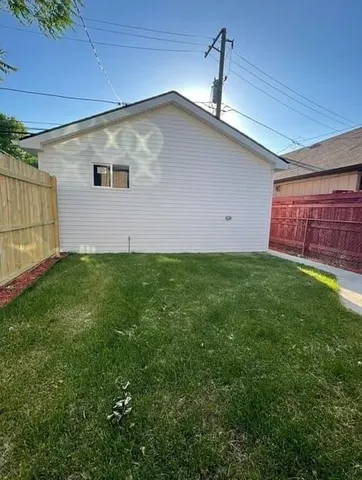 a backyard of a house with lots of green space