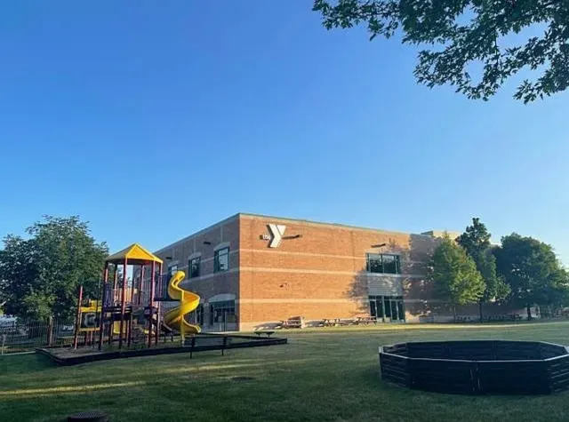a view of a park with large trees