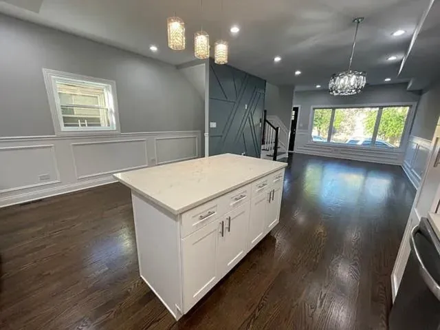 an entryway with wooden floors
