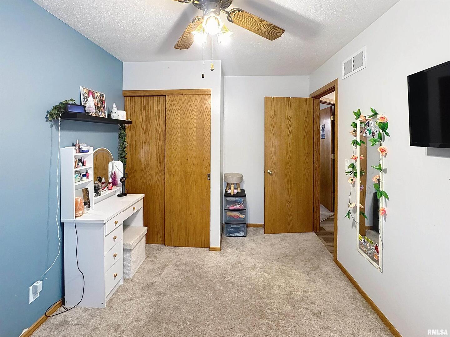 8119 10th Street West Rock Island, IL 61201 - Photo 12 of 25 wooden floor in an empty room with a kitchen