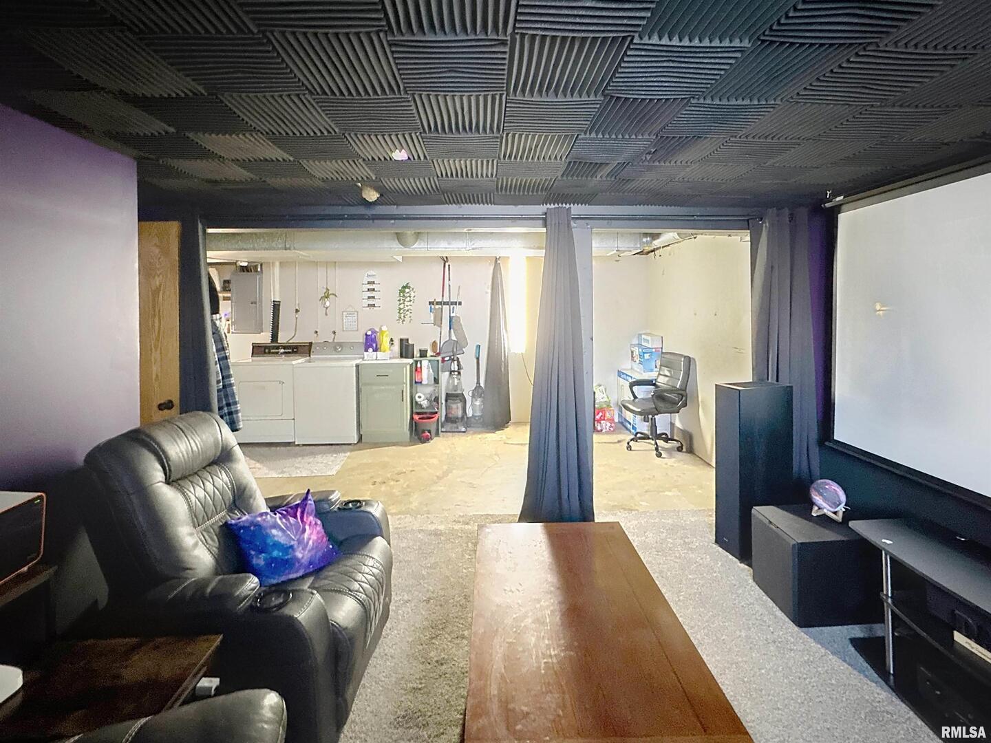 8119 10th Street West Rock Island, IL 61201 - Photo 17 of 25 a living room with furniture and a flat screen tv