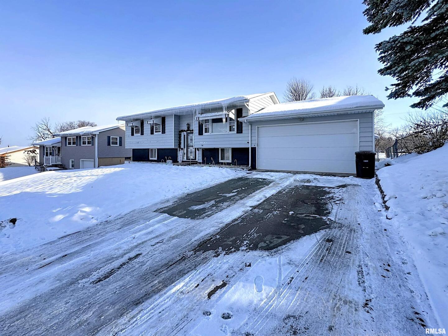 8119 10th Street West Rock Island, IL 61201 - Photo 3 of 25 a view of a house with a patio