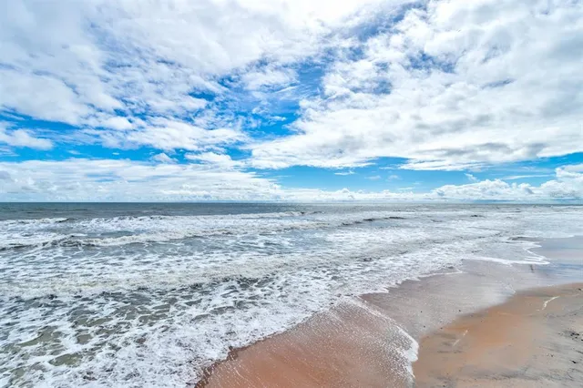 a view of beach and ocean