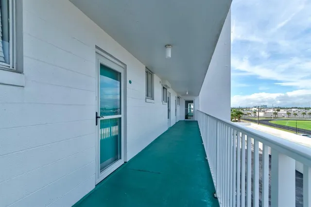 a view of a balcony with an outdoor space