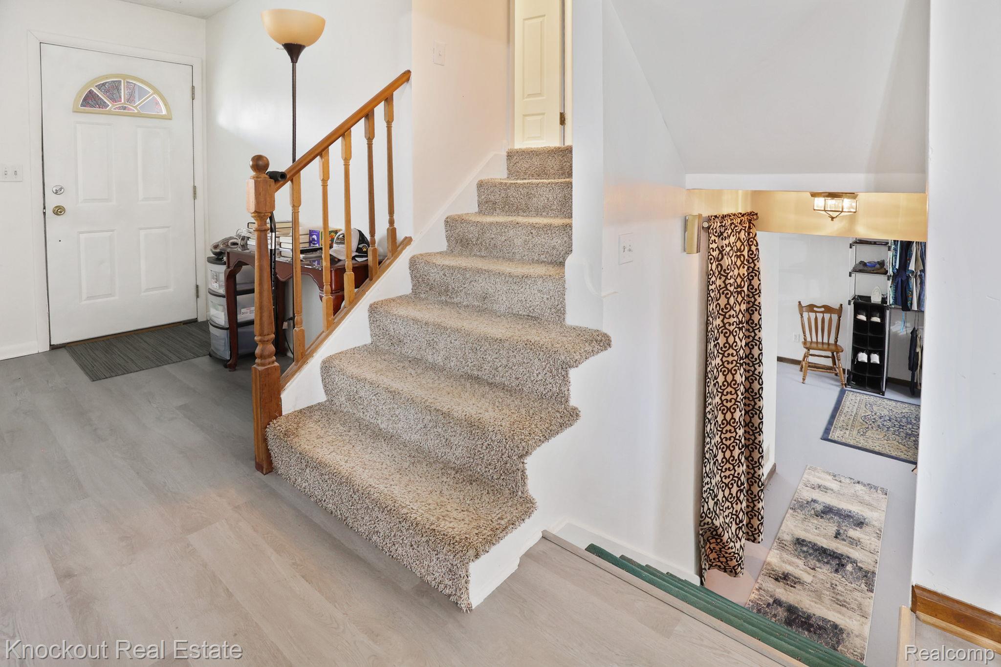 10456 North Nichols Road Montrose, MI 48457 - Photo 25 of 39 Entrance foyer with light wood finished floors and stairway