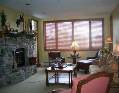 15 Highlands Lane, Unit R107 Beaver Creek, CO 81620 - Photo 2 of 8 a living room with furniture and a fireplace