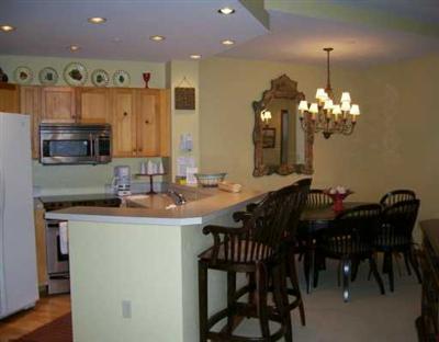 15 Highlands Lane, Unit R107 Beaver Creek, CO 81620 - Photo 4 of 8 a kitchen with a table and chairs in it