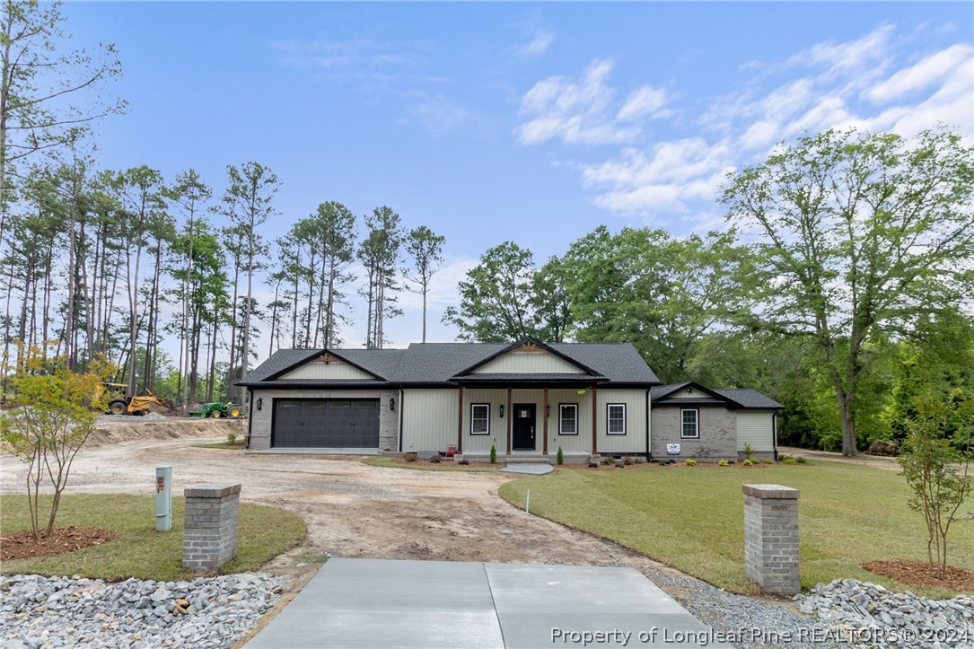 452 Brown Road Carthage, NC 28327 - Photo 1 of 50 a front view of a house with garden