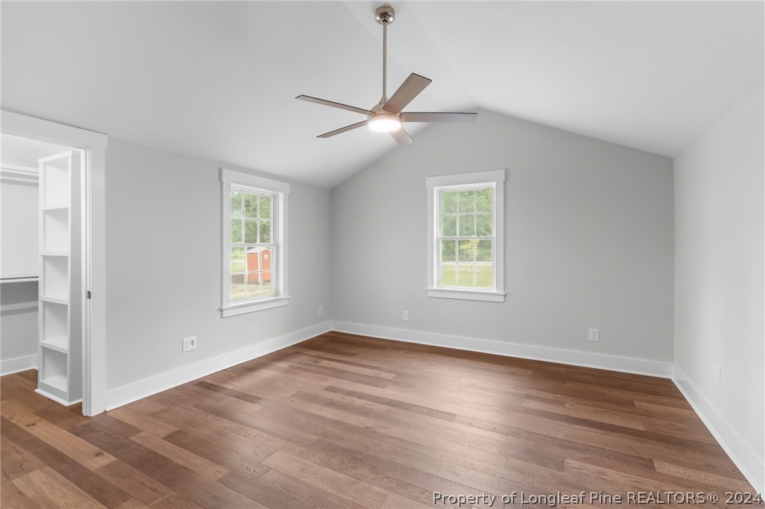 452 Brown Road Carthage, NC 28327 - Photo 21 of 50 a view of an empty room with wooden floor and a window