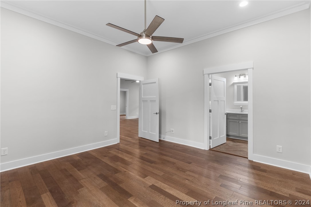 452 Brown Road Carthage, NC 28327 - Photo 39 of 50 an empty room with wooden floor and a ceiling fan