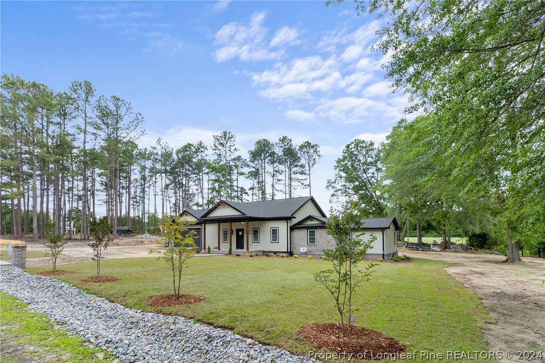 452 Brown Road Carthage, NC 28327 - Photo 5 of 50 a front view of a house with a yard
