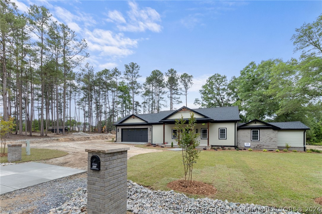 452 Brown Road Carthage, NC 28327 - Photo 6 of 50 a front view of a house with garden