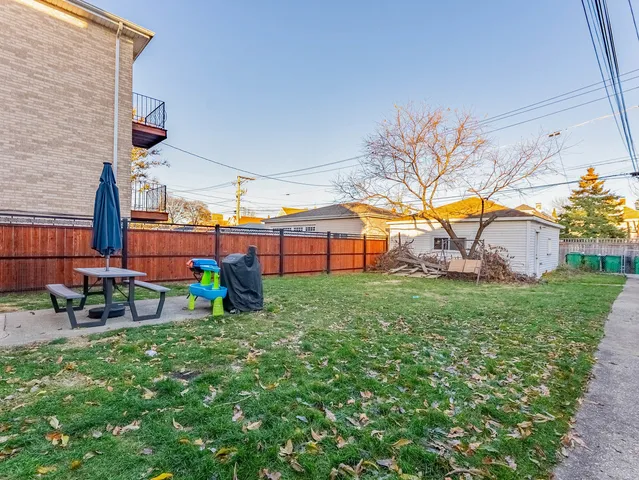 a view of backyard with swimming pool