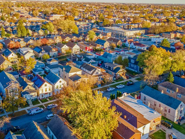 an aerial view of residential houses with outdoor space