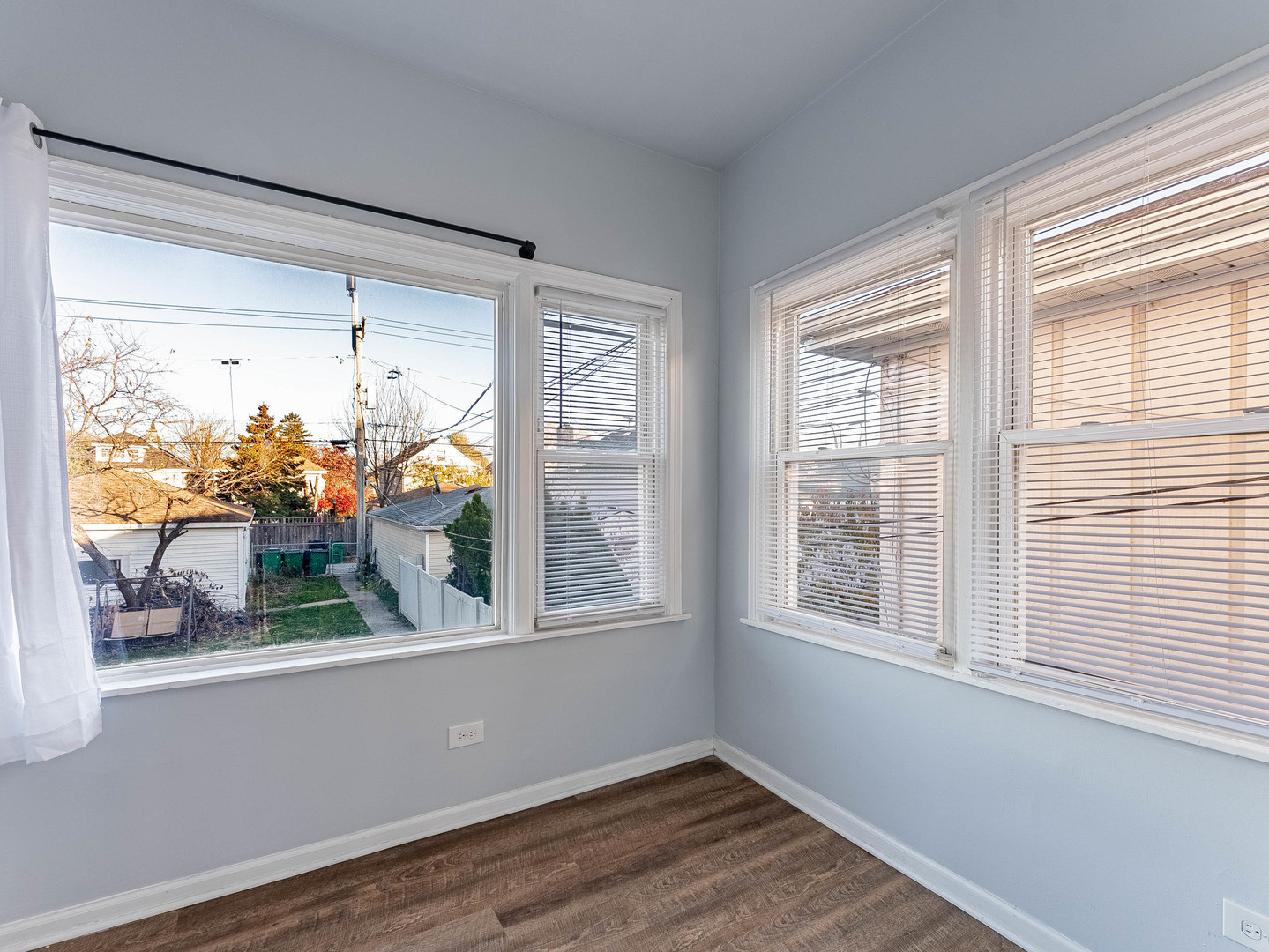 1521 Grove Avenue, Unit 1 Berwyn, IL 60402 - Photo 10 of 27 a view of a room that has wooden floor and a window