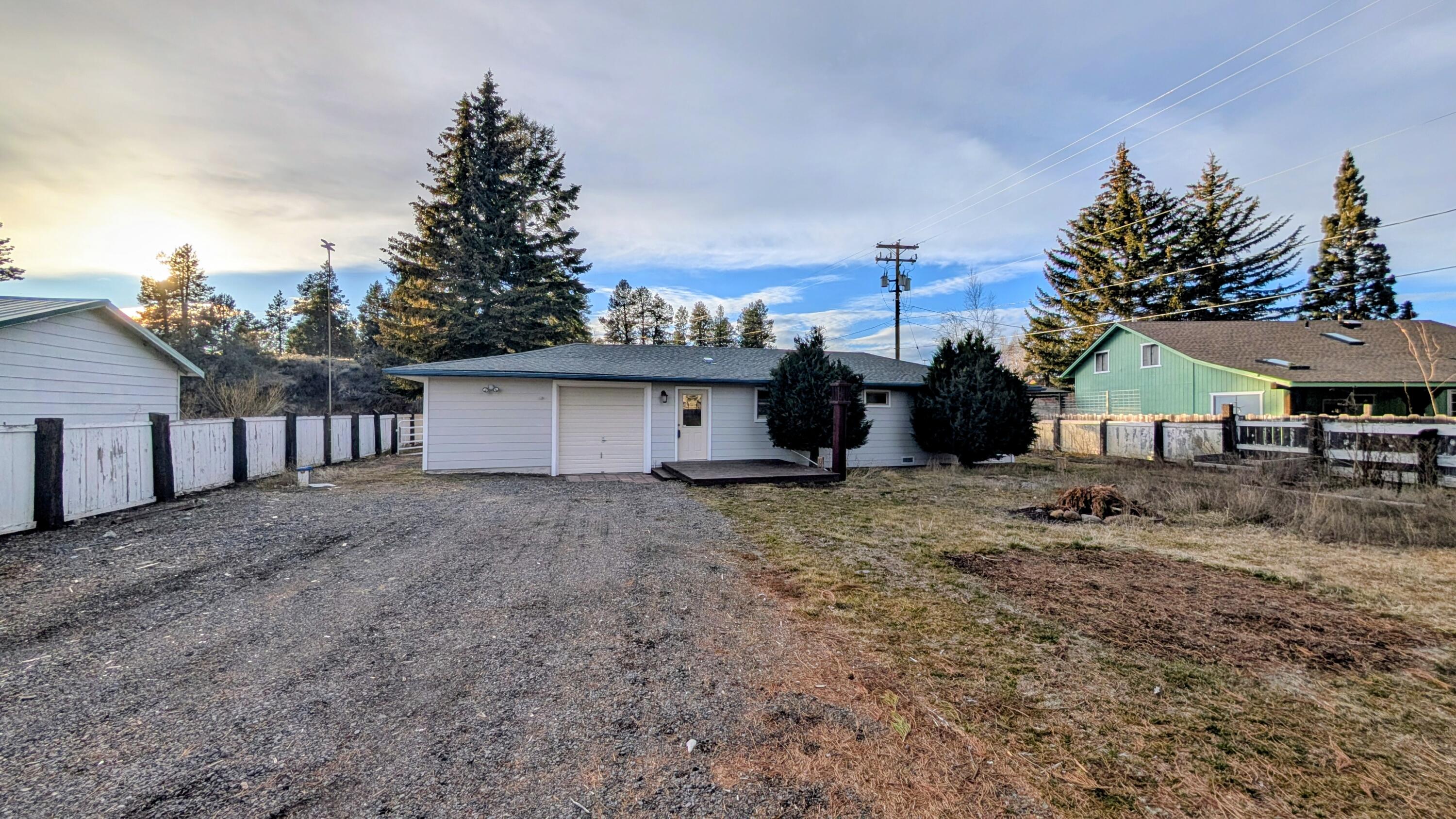 32550 Rivers Drive Chiloquin, OR 97624 - Photo 2 of 24 a view of a house with a yard and garage