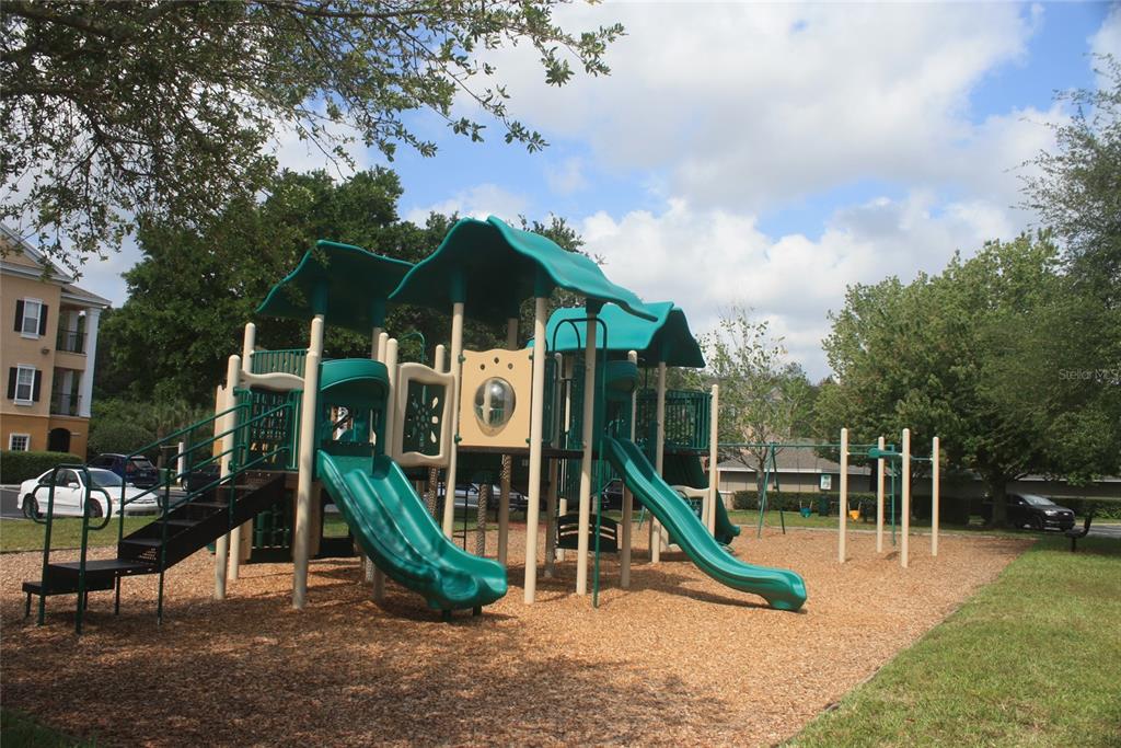 3621 Conroy Road, Unit 739 Orlando, FL 32839 - Photo 19 of 20 a view of a park with a slide