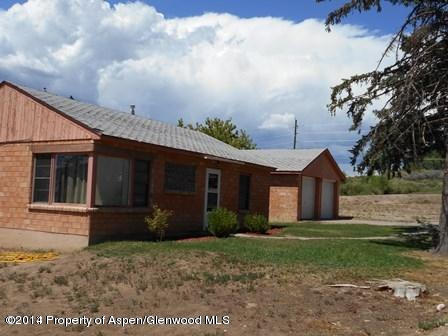621 Jarrad Avenue Rifle, CO 81650 - Photo 8 of 9 a view of a house with backyard and garden