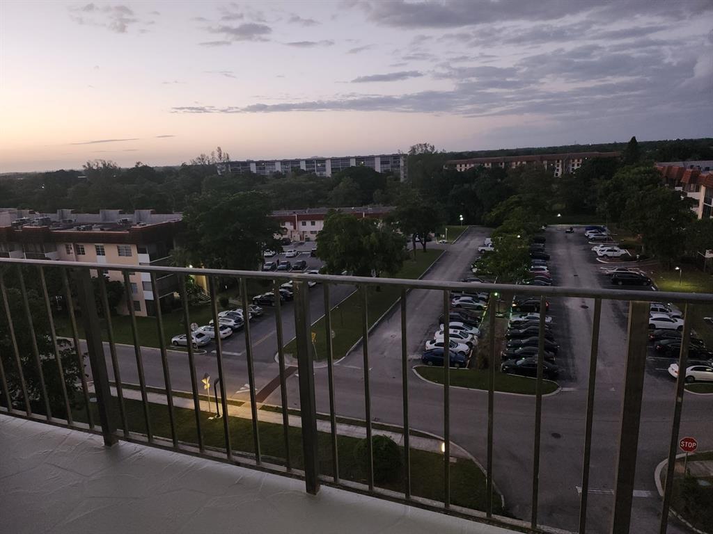 4174 Inverrary Drive, Unit 811 Lauderhill, FL 33319 - Photo 9 of 10 a view of a balcony with wooden floor